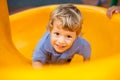 Young boy smiling having fun in the park Royalty Free Stock Photo