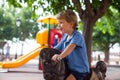 Young boy smiling having fun in the park Royalty Free Stock Photo