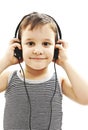 The young boy is smiling and listening to music Royalty Free Stock Photo
