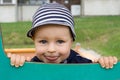 Young boy smiling on the playground Royalty Free Stock Photo