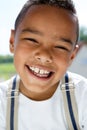 Young boy smiling with suspenders Royalty Free Stock Photo