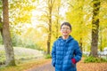 Young boy smiling in yellow autumn park Royalty Free Stock Photo