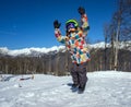 Young boy snowboarder jumping at ski resort in mountains Royalty Free Stock Photo