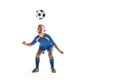 Young boy with soccer ball doing flying kick Royalty Free Stock Photo