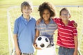 Young Boy With Soccer Ball Standing By Goal Royalty Free Stock Photo