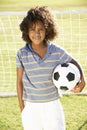 Young Boy With Soccer Ball Standing By Goal Royalty Free Stock Photo