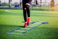 Young boy soccer players Jogging and jump between ladder drills for football training. Ladder drills exercises for football or Royalty Free Stock Photo