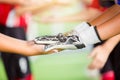Young boy soccer players tap hands together for football training. Soccer players and goalkeeper traning speed hand together