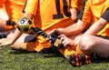 Young boy in sports clothing holding in hand soccer trophy award