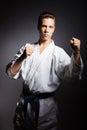 A young boy in a sports kimono in the image judoka. Royalty Free Stock Photo