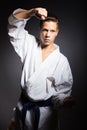 A young boy in a sports kimono in the image judoka. Royalty Free Stock Photo