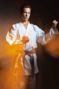 A young boy in a sports kimono in the image judoka. Royalty Free Stock Photo