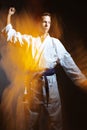 A young boy in a sports kimono in the image judoka. Royalty Free Stock Photo