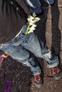 A young boy with a sprig of white flowers in his pocket