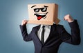 Young boy with happy cardboard box face