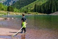 Young Boy Standing by Maroon Creek Royalty Free Stock Photo