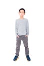 Young boy standing over white