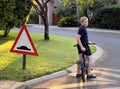 Young Boy Stopped Bicycle at Speed Bump