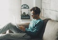 Young boy student age working on laptop in wireless connection for remote school lesson activity at home. Education lifestyle with Royalty Free Stock Photo