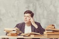 Young boy student sitting near the table with books in glasses. blind guy want learning, have education. online education. Study Royalty Free Stock Photo