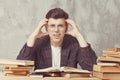 Young boy student sitting near the table with books in glasses. Guy want learning, have education. online education. Study in Royalty Free Stock Photo