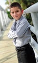 Young boy in suit with arms crossed Royalty Free Stock Photo