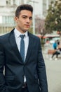 Boy in suit smoking with vaper