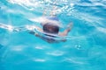 Young boy swim underwater in swimming pool Royalty Free Stock Photo