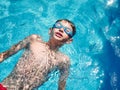 Young boy swimming on a swimming pool. close up look Royalty Free Stock Photo