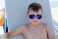 Young boy in a swimsuit on a shelf by the pool Royalty Free Stock Photo