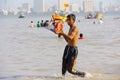 Young boy taking Ganapati idol for immersion, Ganapati visarjan, Girgaon Chowpatty