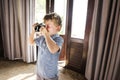 Young boy taking photos with vintage film camera Royalty Free Stock Photo