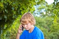 Young boy talking on a cell phone. Royalty Free Stock Photo