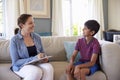 Young Boy Talking With Counselor At Home Royalty Free Stock Photo