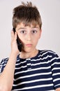 Young boy talking on his smart phone Royalty Free Stock Photo