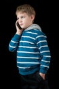 Young boy talking on mobile phone