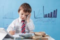 Young boy, talking on the phone, writing notes, money and tablet Royalty Free Stock Photo