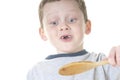 Young boy tasting food Royalty Free Stock Photo