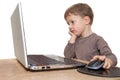 Young boy thinking in front of laptop Royalty Free Stock Photo