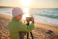 Young boy tries to learn photography Royalty Free Stock Photo