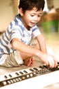 Young boy trying out a keyboard Royalty Free Stock Photo