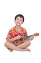 Young boy with ukulele over white Royalty Free Stock Photo