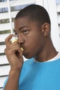 Young Boy Using Asthma Inhaler Royalty Free Stock Photo