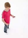 Young boy using cellular phone Royalty Free Stock Photo