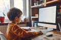 Young Boy Using Computer at Home Royalty Free Stock Photo