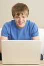 Young Boy Using Laptop At Home Royalty Free Stock Photo