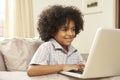 Young Boy Using Laptop At Home Royalty Free Stock Photo