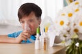 Young boy using a nebulizer inhaler device - respiratory disease and allergy relieve concept