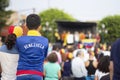 Young boy with Venezuelan watching a stage at Venezuelan protest