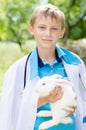 Young boy veterinary and little rabbit Royalty Free Stock Photo